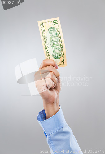 Image of Businessman hand hold with cash