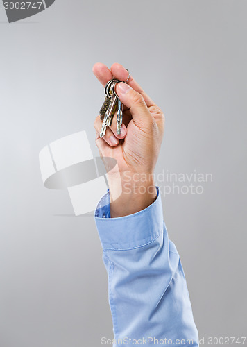 Image of Businessman hand hold with key