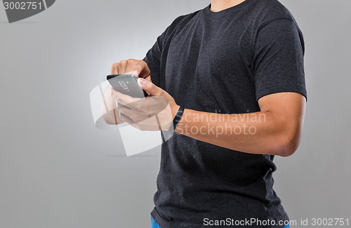 Image of Man use mobile phone sync with activity tracker