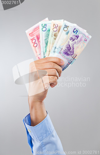 Image of Businessman hand hold with chinese banknote