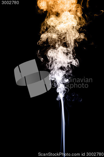 Image of Gold and white smoke on black background 