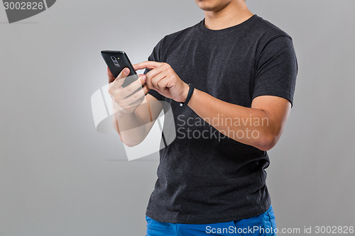 Image of Man with smart device and use of mobile phone