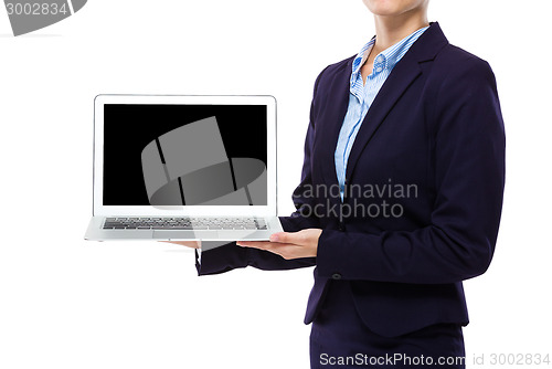 Image of Businesswoman show laptop computer with blank screen