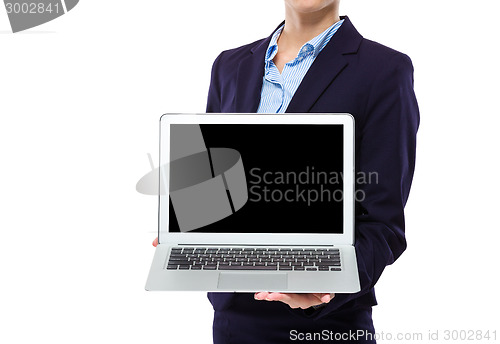 Image of Businesswoman show with blank screen of laptop computer