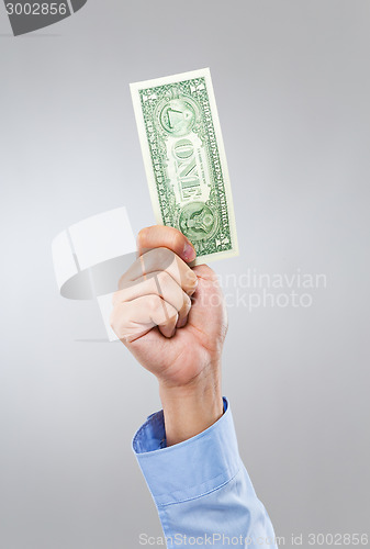 Image of Businessman hand hold with one dollar