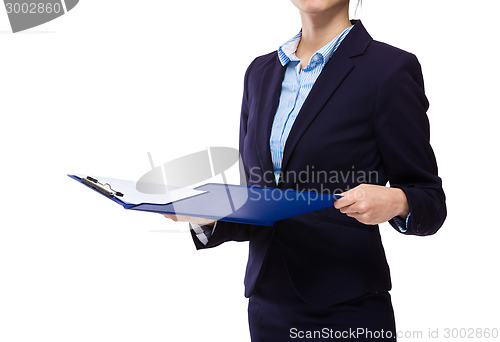 Image of Businesswoman check with clipboard