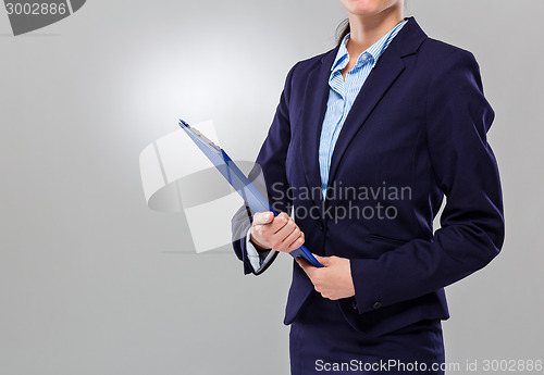 Image of Businesswoman hold with clipboard