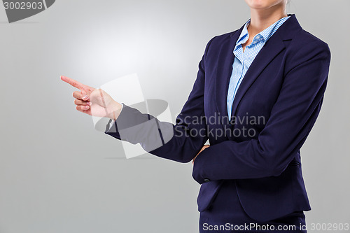 Image of Businesswoman finger point aside