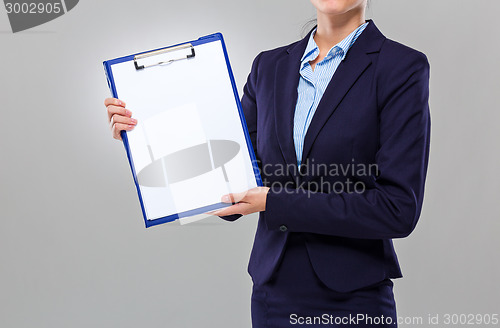 Image of Businesswoman show with blank clipboard