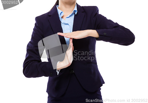 Image of Businesswoman with pause hand gesture 