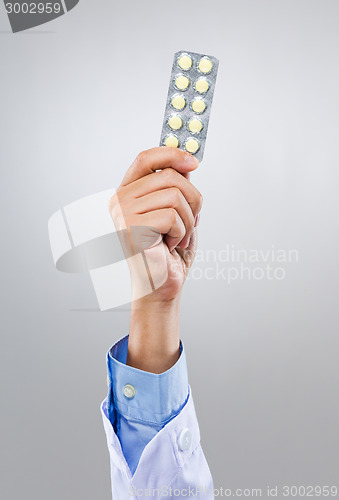 Image of Doctor hold with pack of medicine