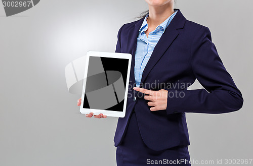 Image of Businesswoman finger point to blank screen of digital tablet