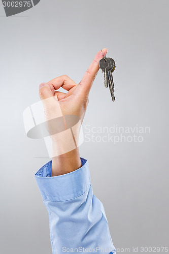 Image of Businessman hand hold with home key