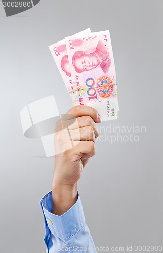 Image of Businessman hold with chinese yuan