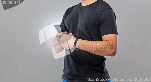 Image of Man use mobile phone sync with wearble device
