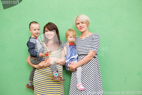 Image of two beautiful girls with a children