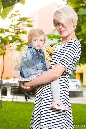 Image of Young mother and her toddler girl