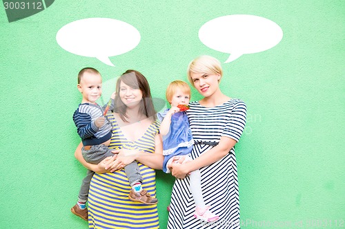 Image of two beautiful girls with a children