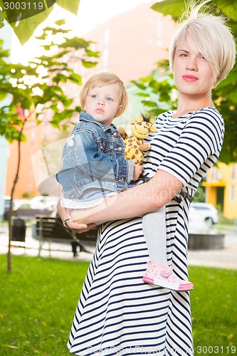 Image of Young mother and her toddler girl