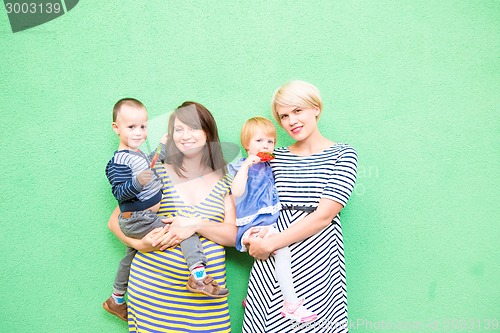 Image of two beautiful girls with a children