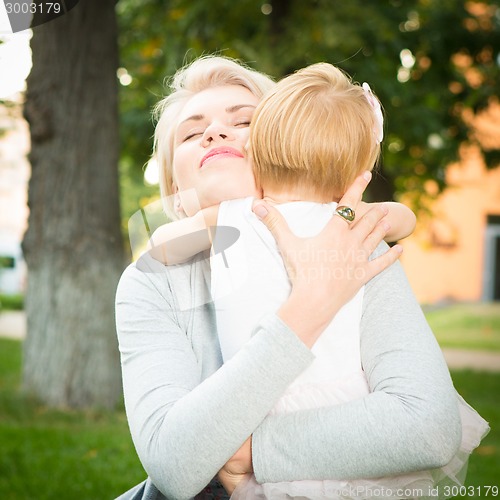 Image of happy mother holding her child