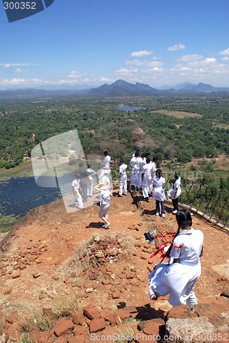 Image of People on the top of rock