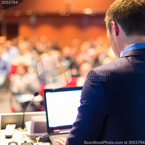 Image of Public speaker at Business Conference.