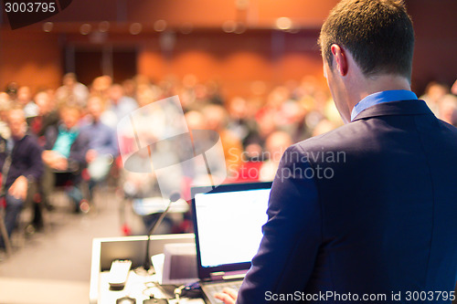Image of Public speaker at Business Conference.