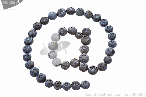 Image of At sign made from blueberries