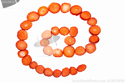 Image of At symbol made from strawberry slices