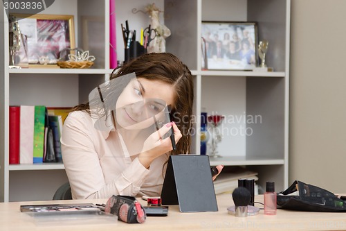 Image of Office worker gets tone cream on face