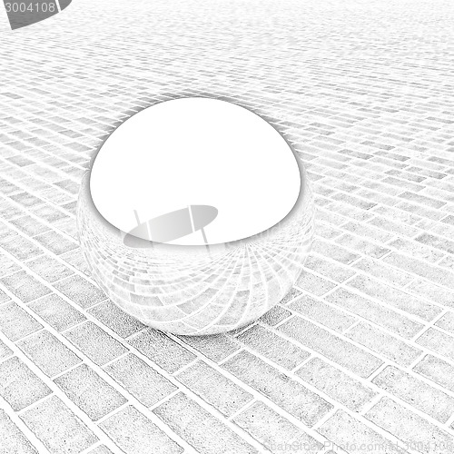 Image of Chrome ball on the brick floor 