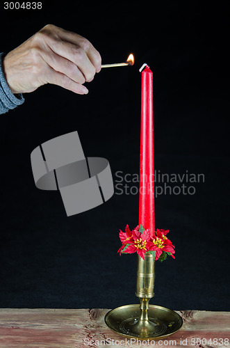 Image of Lighting a christmas candle