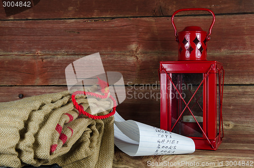 Image of Santas equipment - burlap bag, wish list and lantern