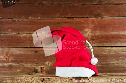 Image of Santas cap at old weathered wooden background