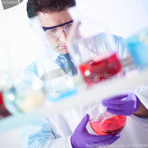 Image of Chemist searching for the right solution.