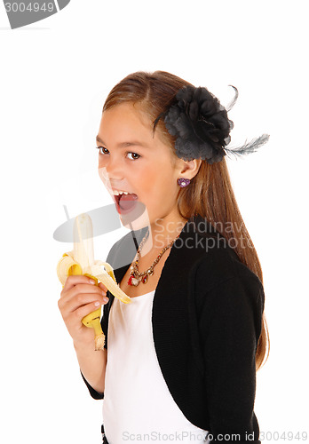 Image of Girl eating banana.