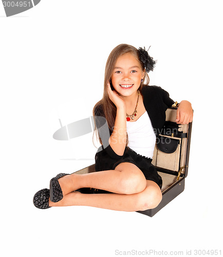 Image of Young girl in briefcase.
