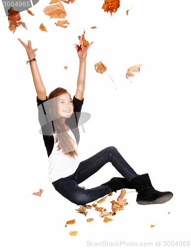 Image of Girl with falling leaves.
