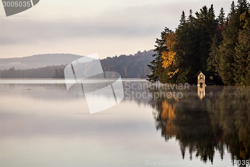 Image of Lake in Autumn sunrise reflection