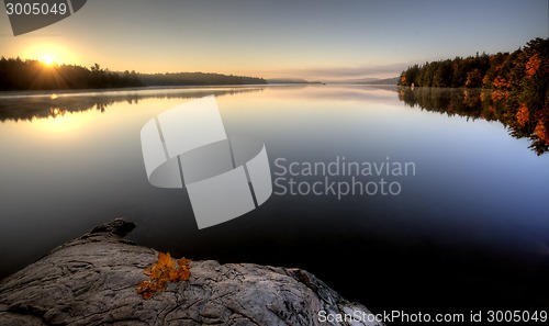 Image of Lake in Autumn sunrise reflection