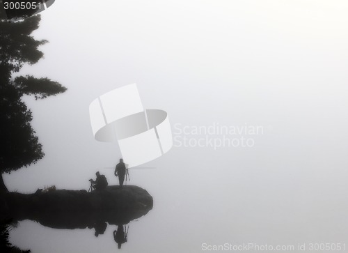 Image of Sillouette Photographers in the mist