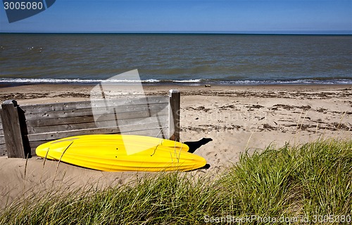 Image of Yellow Kayak on shore