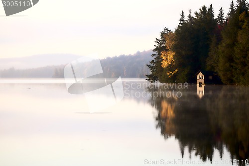 Image of Lake in Autumn sunrise reflection