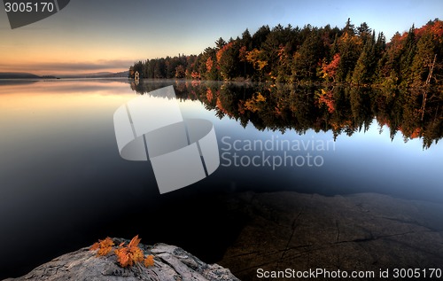 Image of Lake in Autumn sunrise reflection