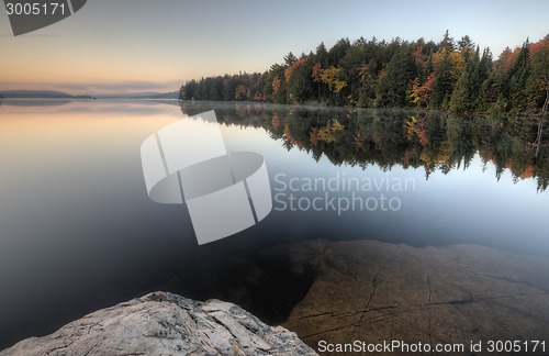 Image of Lake in Autumn sunrise reflection