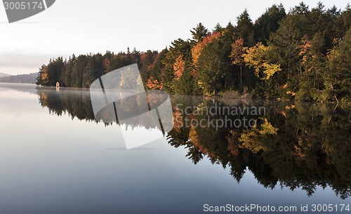 Image of Lake in Autumn sunrise reflection