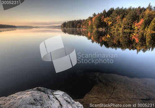 Image of Lake in Autumn sunrise reflection