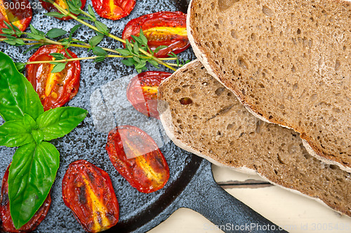 Image of baked cherry tomatoes with basil and thyme