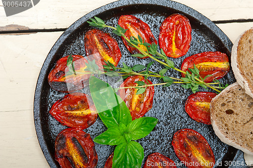 Image of baked cherry tomatoes with basil and thyme